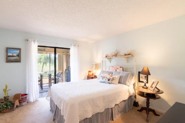 a bedroom with a bed and a table