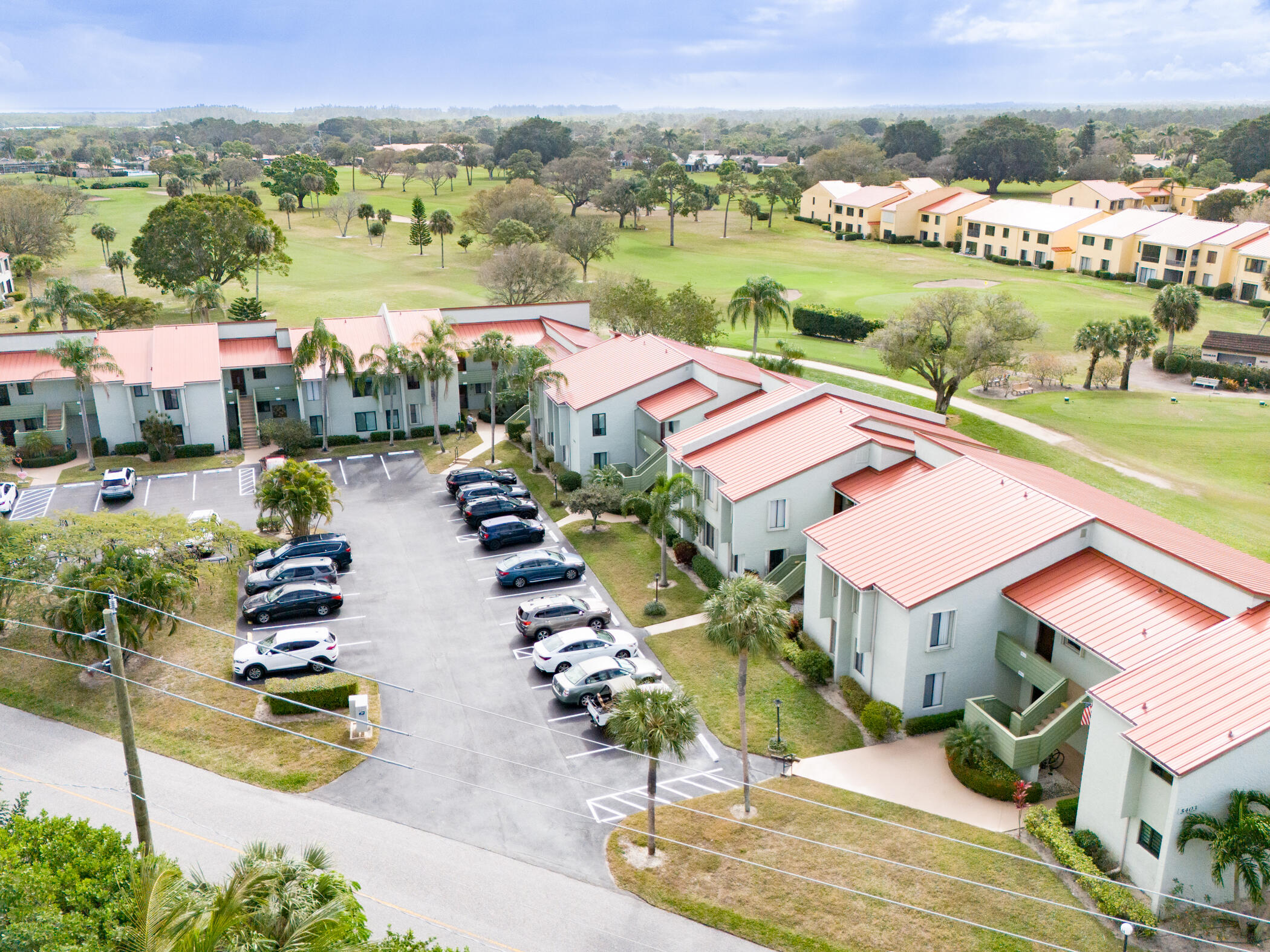 5403 Southeast Miles Grant Road, Unit 111 Stuart, FL 34997 - Photo 20 of 29 an aerial view of a city with lake view