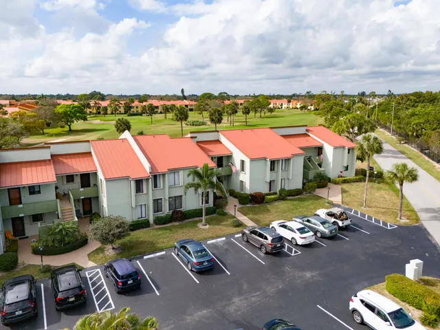 an aerial view of a houses with yard
