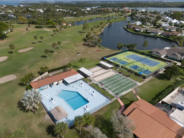 an aerial view of a house with outdoor space