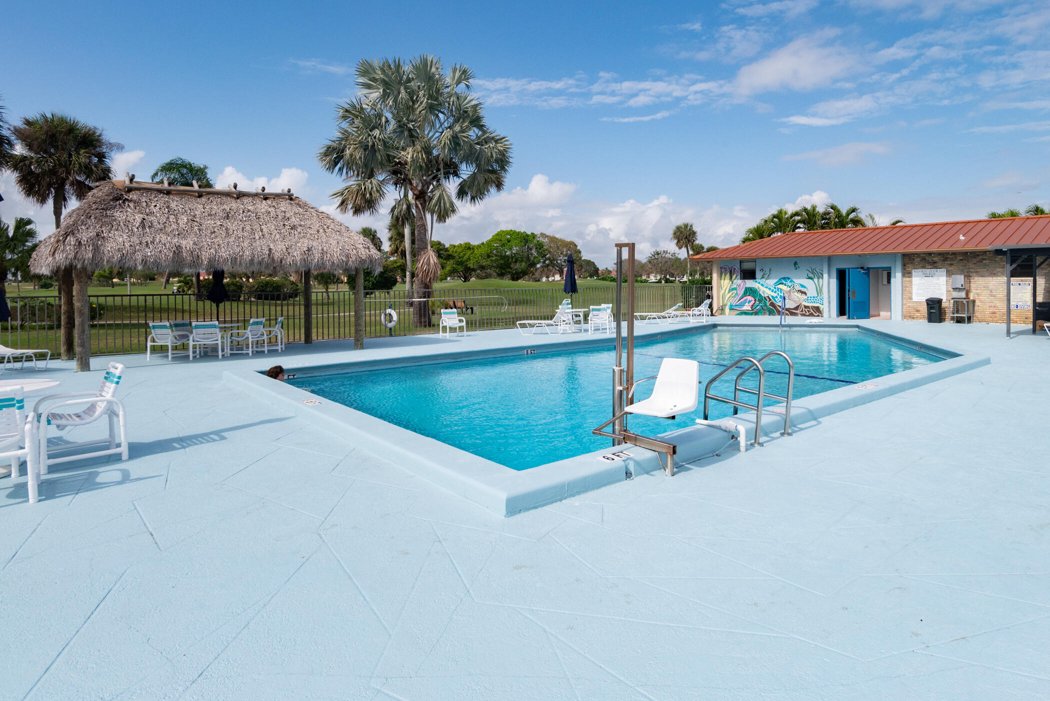 5403 Southeast Miles Grant Road, Unit 111 Stuart, FL 34997 - Photo 28 of 29 an outdoor view of house with swimming pool having outdoor seating
