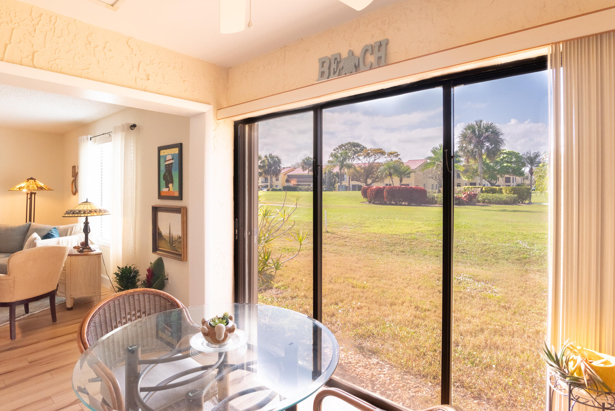 5403 Southeast Miles Grant Road, Unit 111 Stuart, FL 34997 - Photo 10 of 29 a living room with furniture and a large window