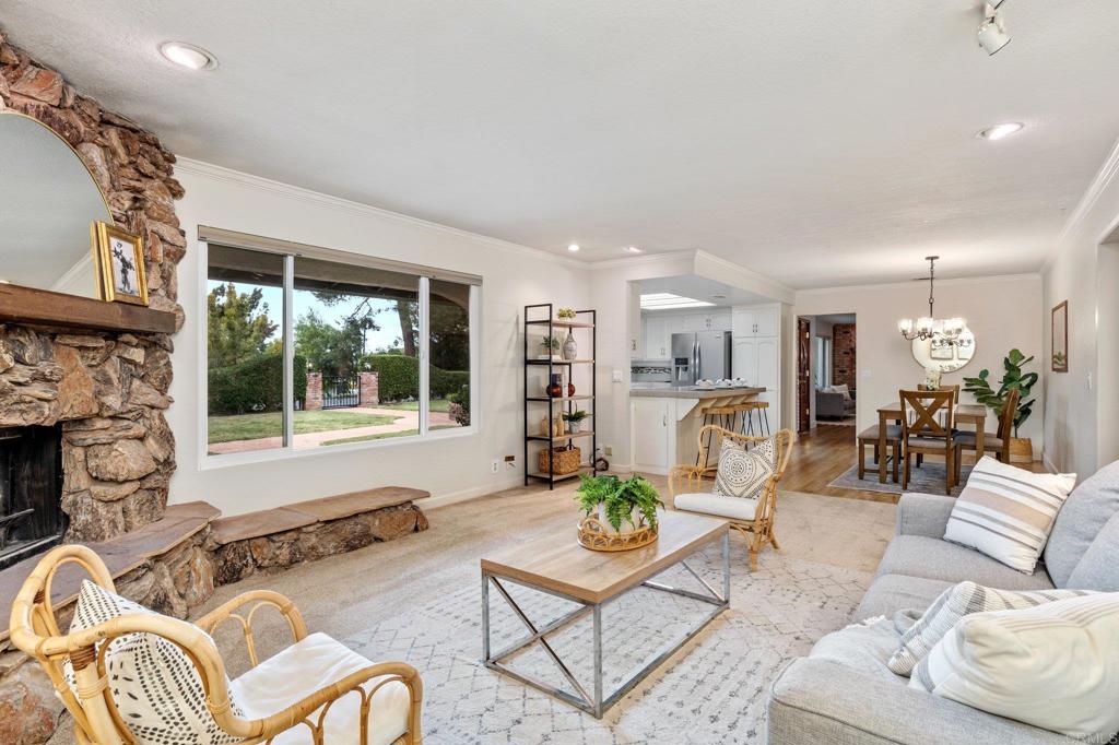 1317 Rincon Road Escondido, CA 92025 - Photo 16 of 42 a living room with furniture large window and flat screen tv
