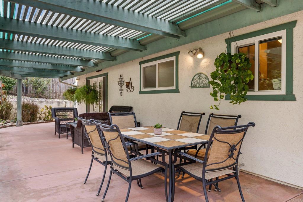 1317 Rincon Road Escondido, CA 92025 - Photo 29 of 42 a view of an outdoor dining space with a table and chairs