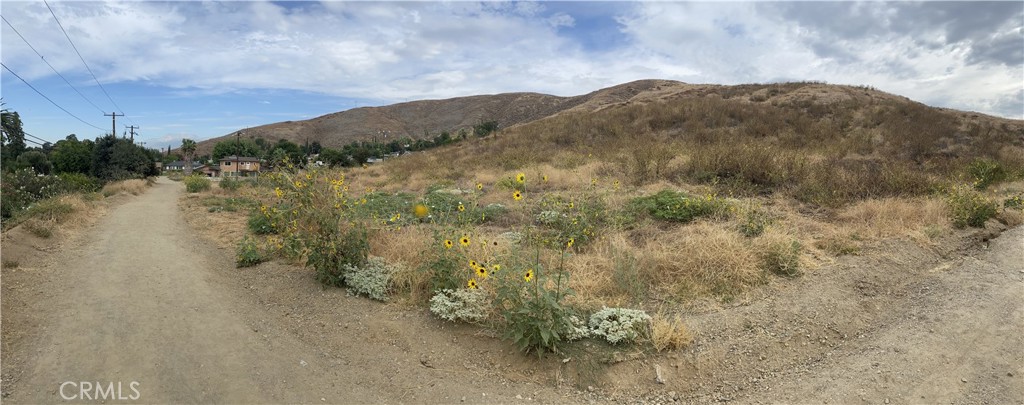 0 Grande Vista Avenue San Bernardino, CA 92405 - Photo 7 of 9 a view of a lake with mountains in the background