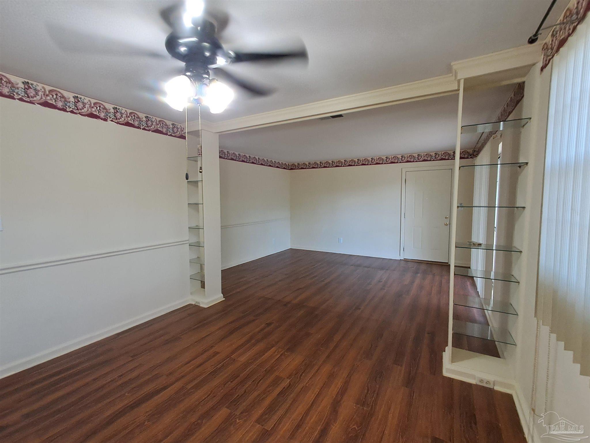 4929 Springhill Drive Pensacola, FL 32503 - Photo 3 of 16 a view of a room with wooden floor