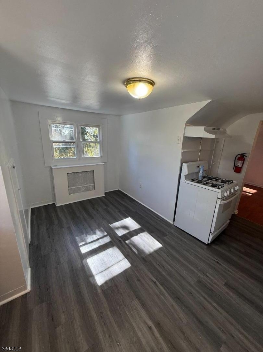 224 Westervelt Avenue Hawthorne, NJ 07506 - Photo 3 of 9 a view of workspace with wooden floor and window