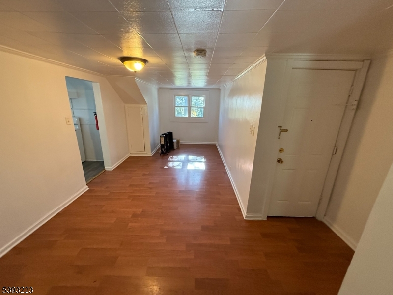 224 Westervelt Avenue Hawthorne, NJ 07506 - Photo 6 of 9 a view of entryway and hall with a window