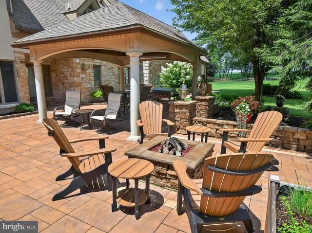 a dining room with furniture a rug and wooden floor