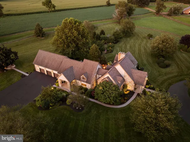 a living room with furniture large window and a flat screen tv