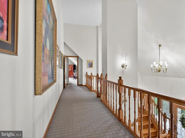 an aerial view of a house with outdoor space and lake view