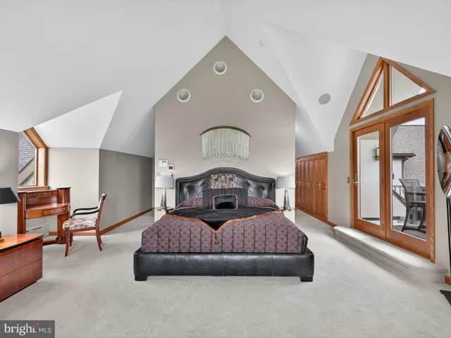 an aerial view of a house with a lake view