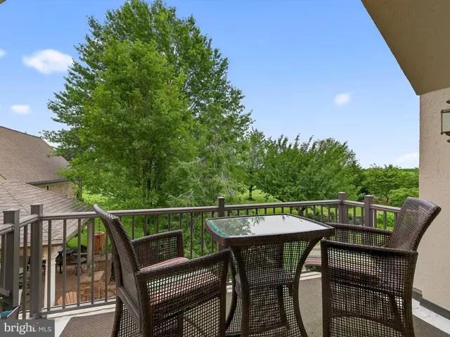a front view of a house with a yard and a garage