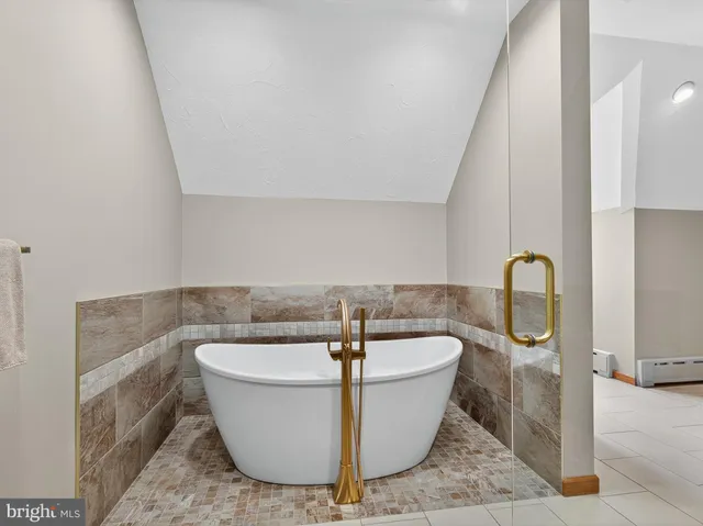 an aerial view of a house with a lake view