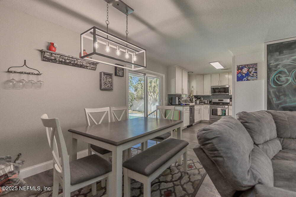 14443 Stacey Road Jacksonville, FL 32250 - Photo 12 of 31 a view of a dining room with furniture
