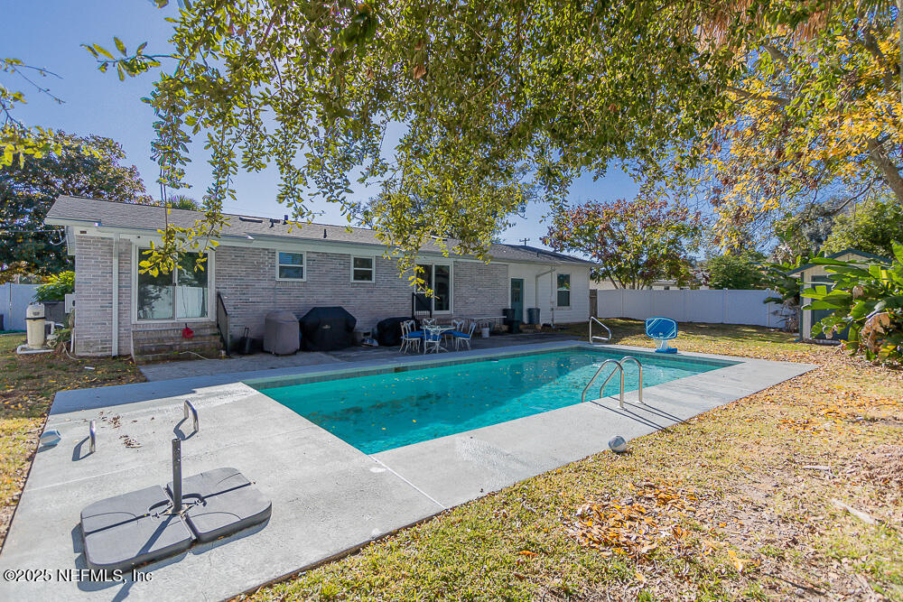 14443 Stacey Road Jacksonville, FL 32250 - Photo 2 of 31 a view of a house with backyard and sitting area