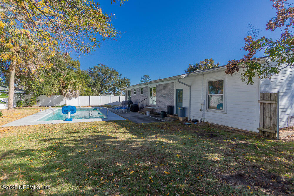 14443 Stacey Road Jacksonville, FL 32250 - Photo 28 of 31 a view of a house with backyard and sitting area
