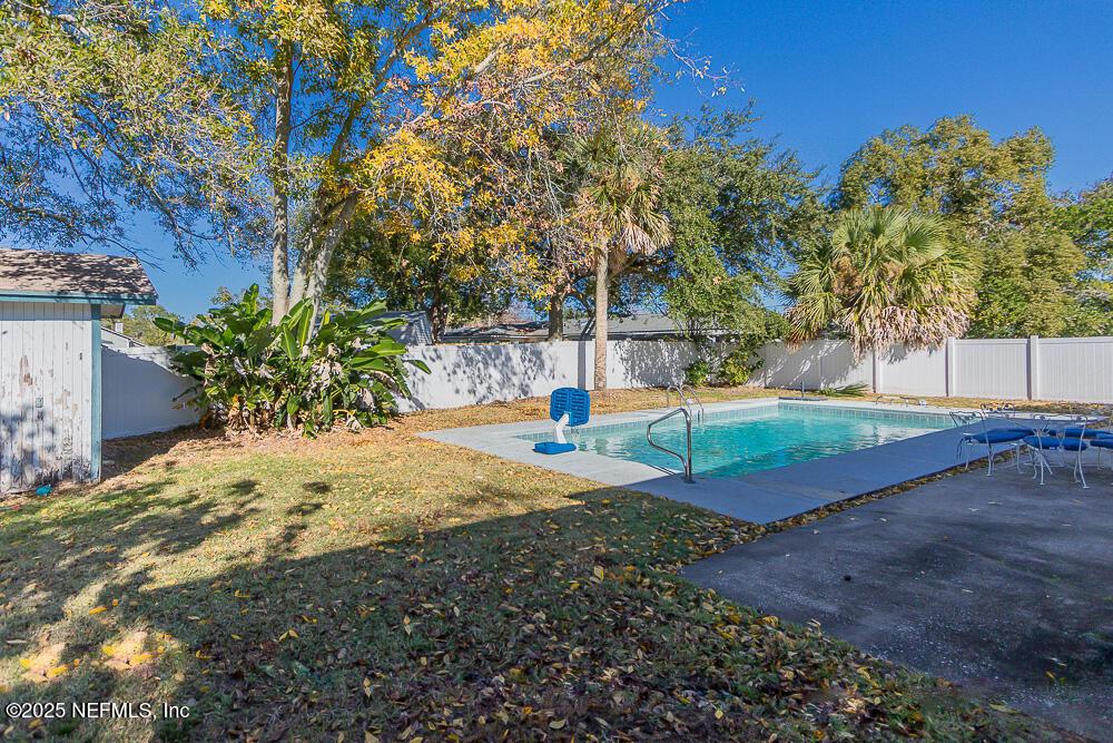 14443 Stacey Road Jacksonville, FL 32250 - Photo 29 of 31 a view of a yard with plants and trees