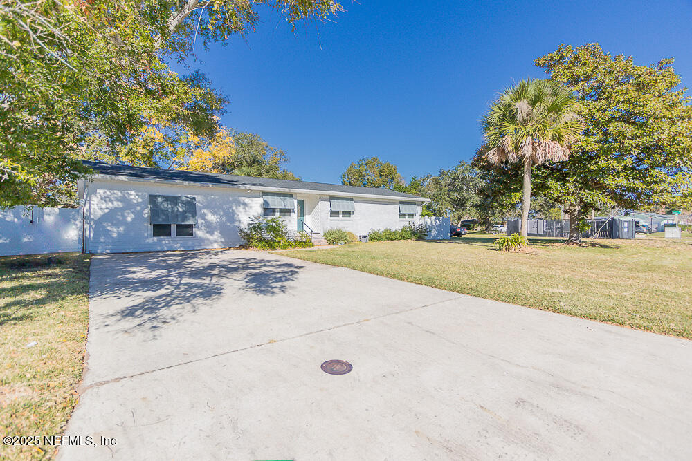14443 Stacey Road Jacksonville, FL 32250 - Photo 6 of 31 a view of swimming pool with a house in the background