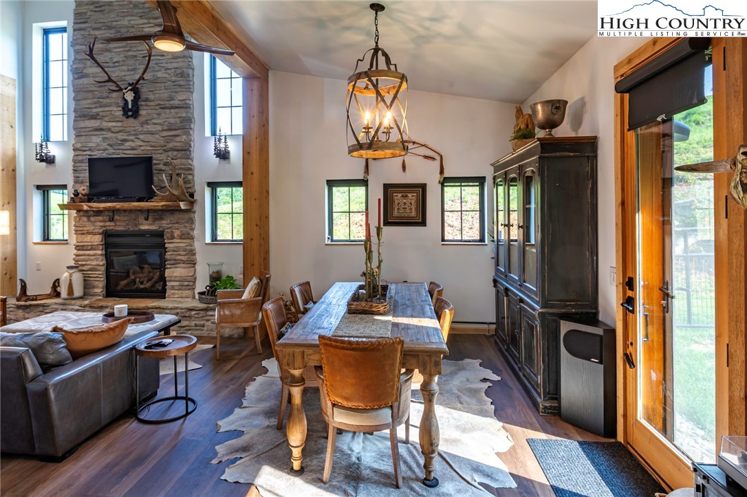 509 Grant Houck Road Todd, NC 28684 - Photo 26 of 50 a dining room with furniture a window and wooden floor