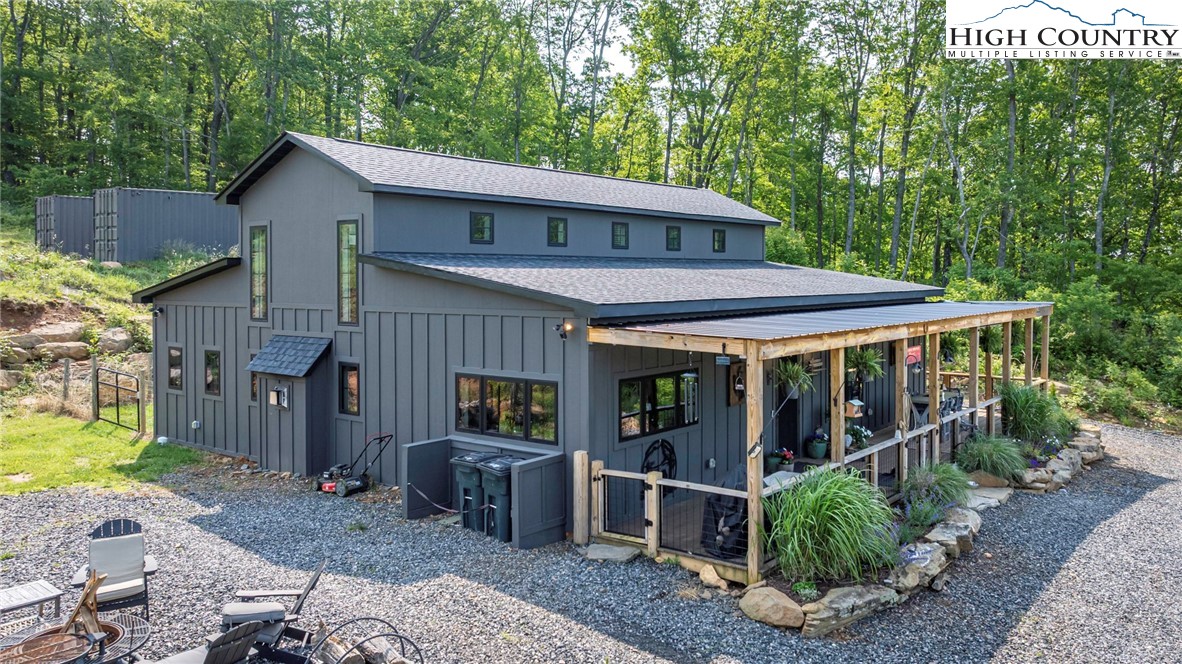 509 Grant Houck Road Todd, NC 28684 - Photo 3 of 50 a view of a house with backyard and porch