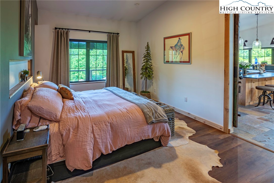 509 Grant Houck Road Todd, NC 28684 - Photo 34 of 50 a bed sitting in a bedroom next to a window