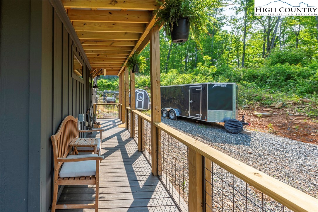 509 Grant Houck Road Todd, NC 28684 - Photo 49 of 50 a view of balcony with wooden floor and outdoor seating