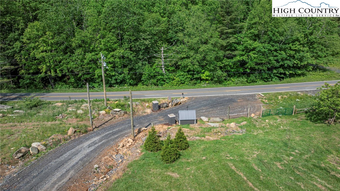 509 Grant Houck Road Todd, NC 28684 - Photo 8 of 50 a view of a water pond with green yard