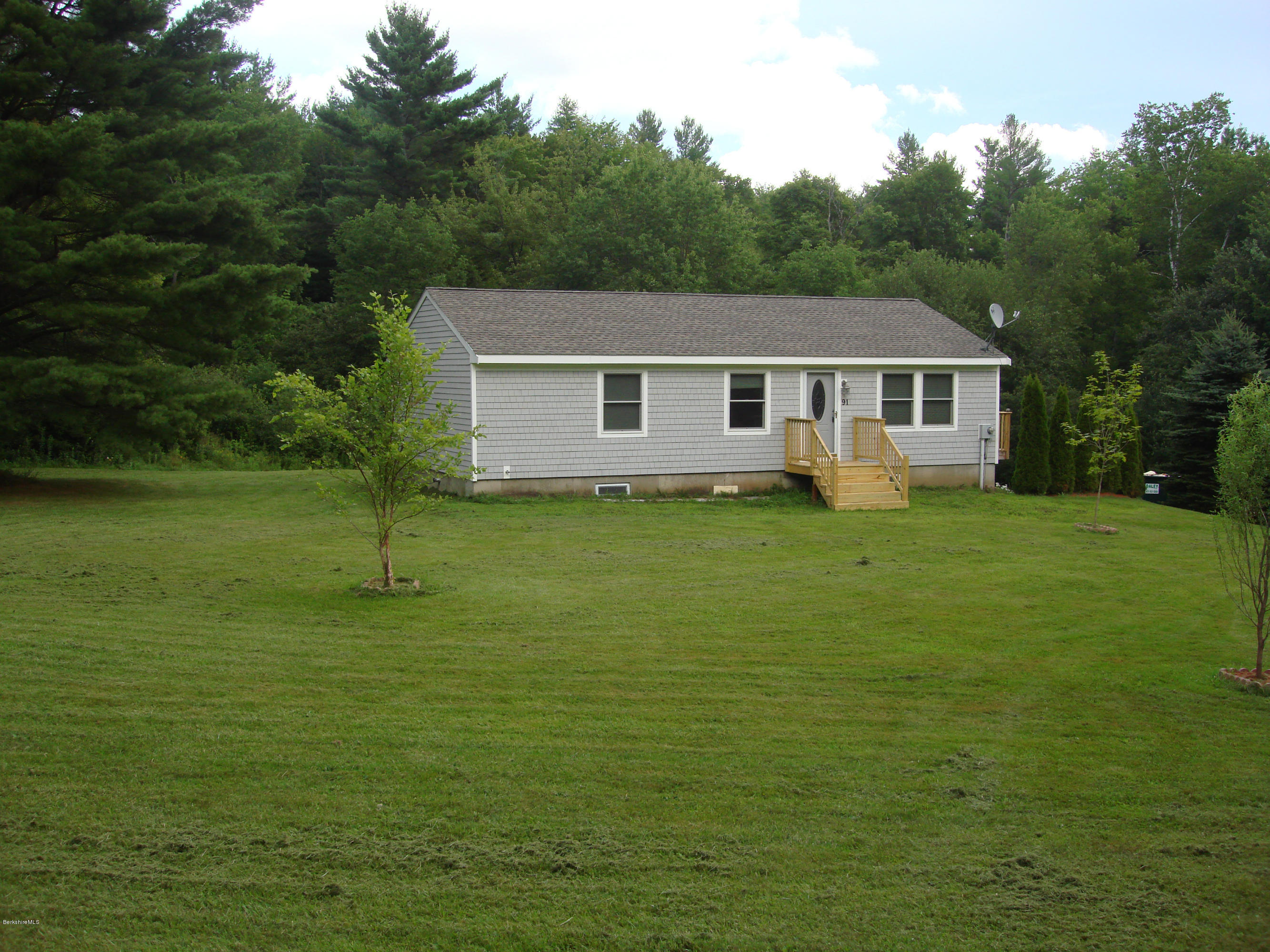 91 Middlefield Road Peru, MA 01235 - Photo 20 of 21 a view of a house with a yard