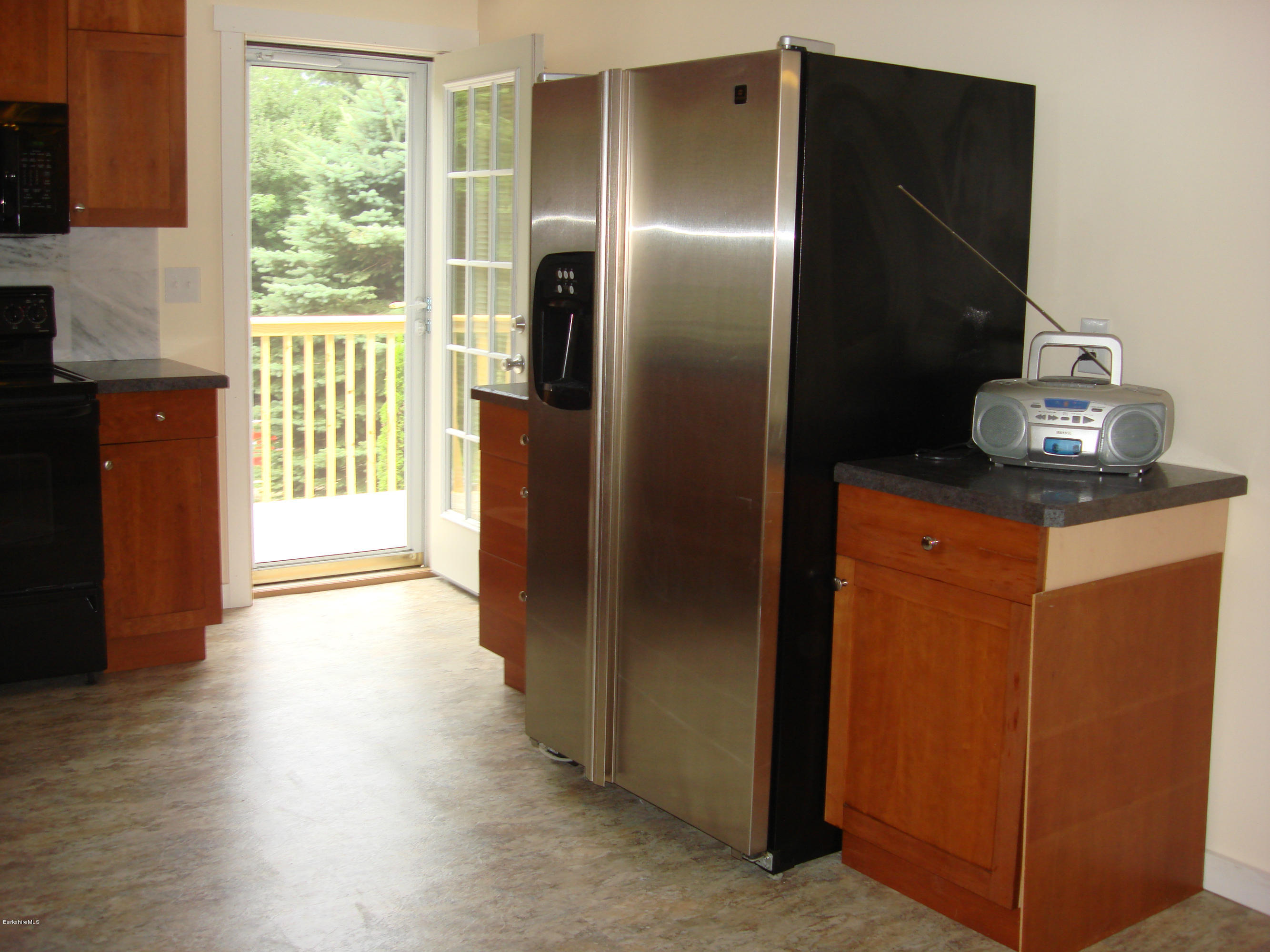 91 Middlefield Road Peru, MA 01235 - Photo 4 of 21 a kitchen with stainless steel appliances granite countertop a refrigerator and a cabinets