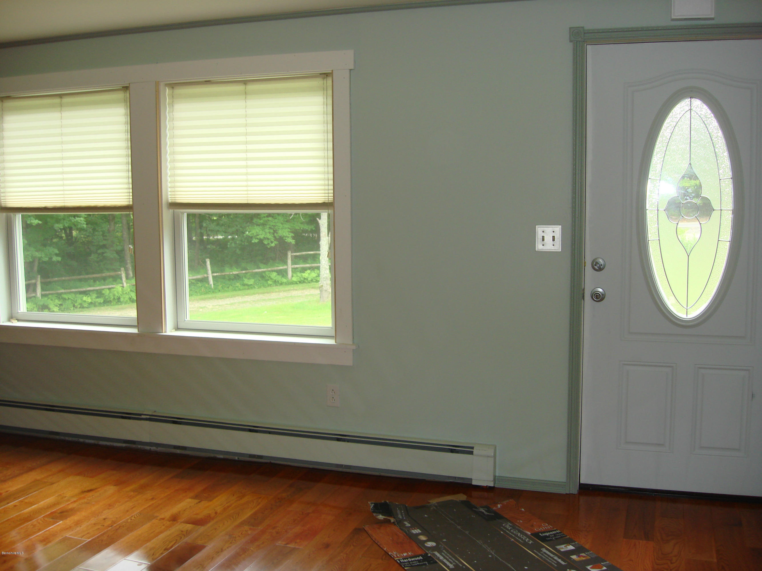 91 Middlefield Road Peru, MA 01235 - Photo 6 of 21 a view of a livingroom with wooden floor and a window