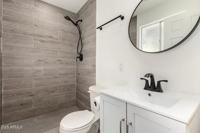 a view of an empty room and wooden floor