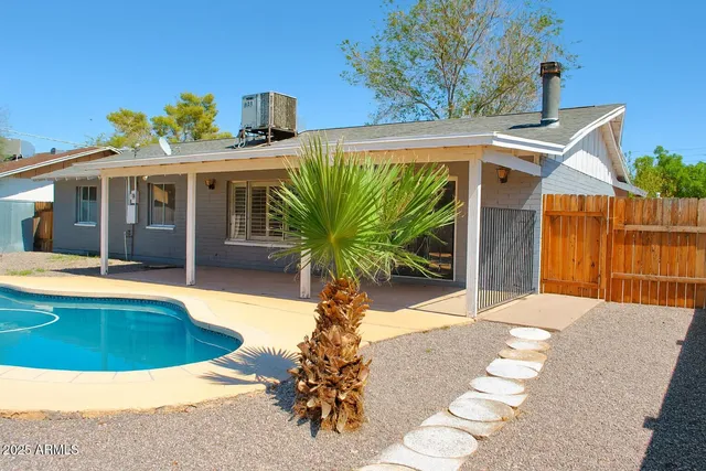 a view of a house with swimming pool