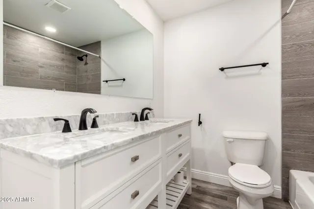 a bathroom with a bathtub and shower