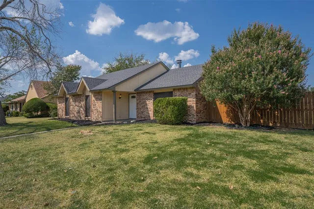a house view with a garden space