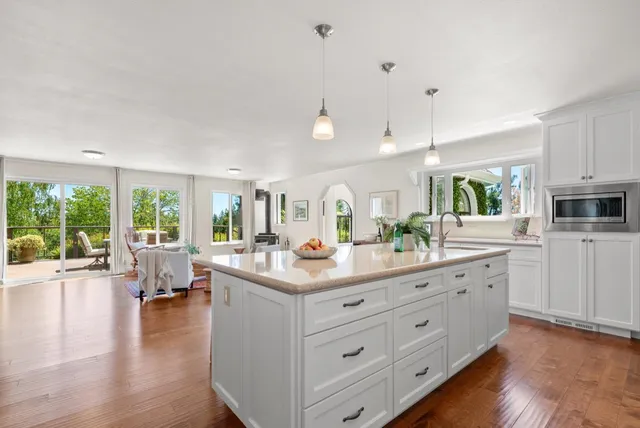 a spacious bedroom with a large bed and a window