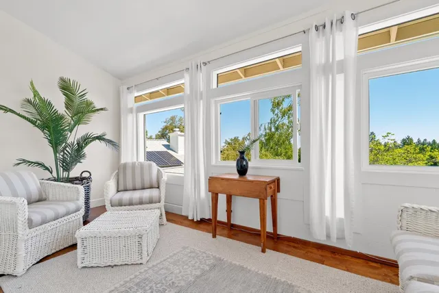 a view of a balcony with wooden floor and lake view