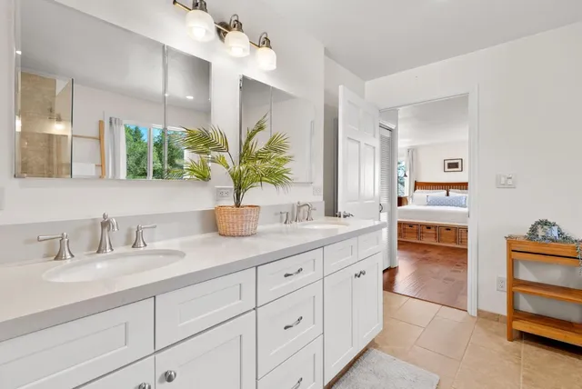 a view of a chairs and table on the wooden deck
