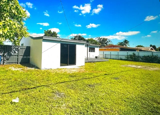 a view of a swimming pool with an outdoor space and seating area