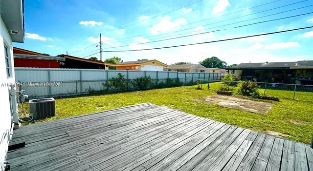 a view of swimming pool with a backyard