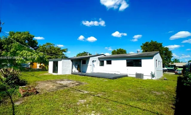 a white house with a small yard