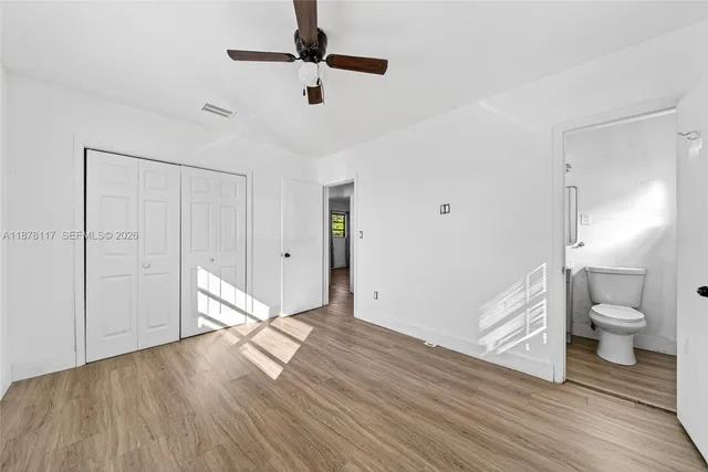 a bathroom with a sink toilet a mirror and shower