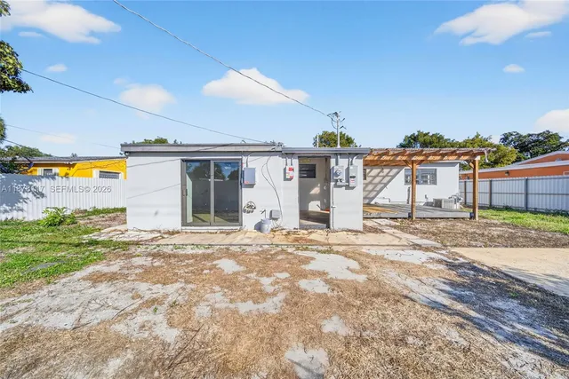 a view of a house with a backyard and a garage