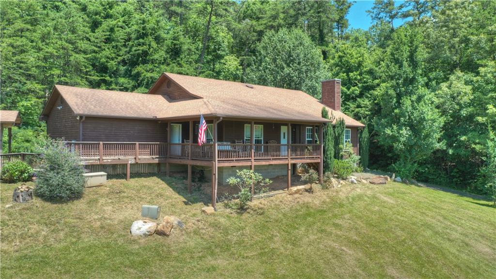 106 Old Cashes Valley Road Blue Ridge, GA 30513 - Photo 1 of 1 a view of house with a yard
