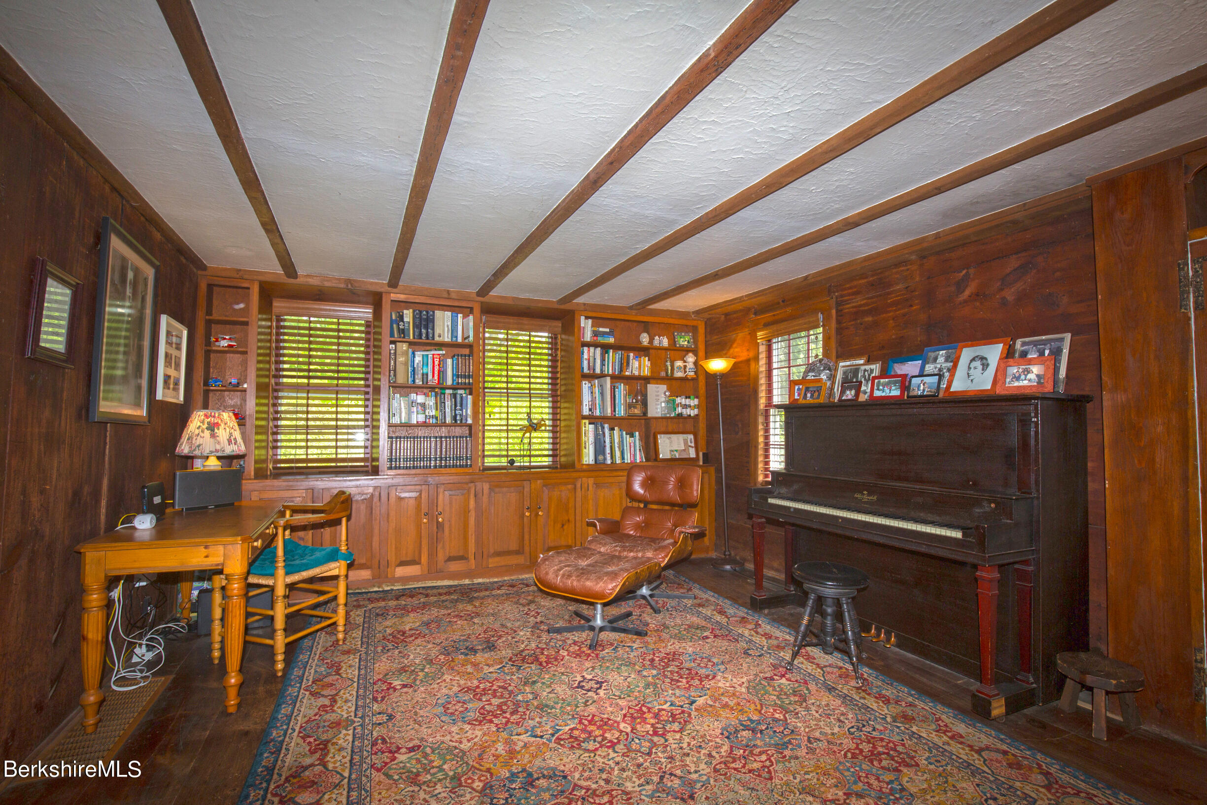 75 Old Quarry Road Otis, MA 01253 - Photo 11 of 39 a living room with furniture a rug and a floor to ceiling window