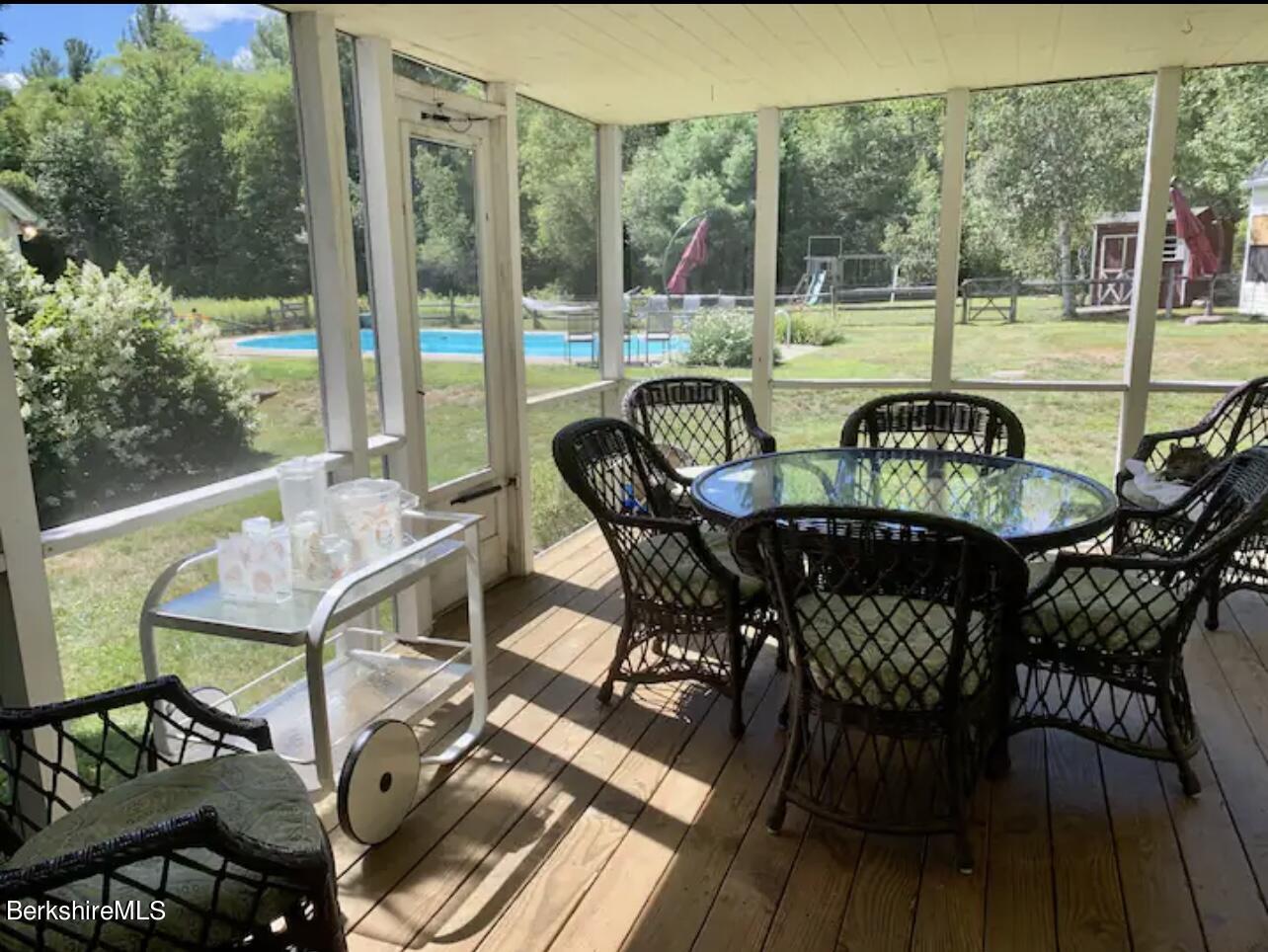 75 Old Quarry Road Otis, MA 01253 - Photo 14 of 39 a view of a chairs and table in patio