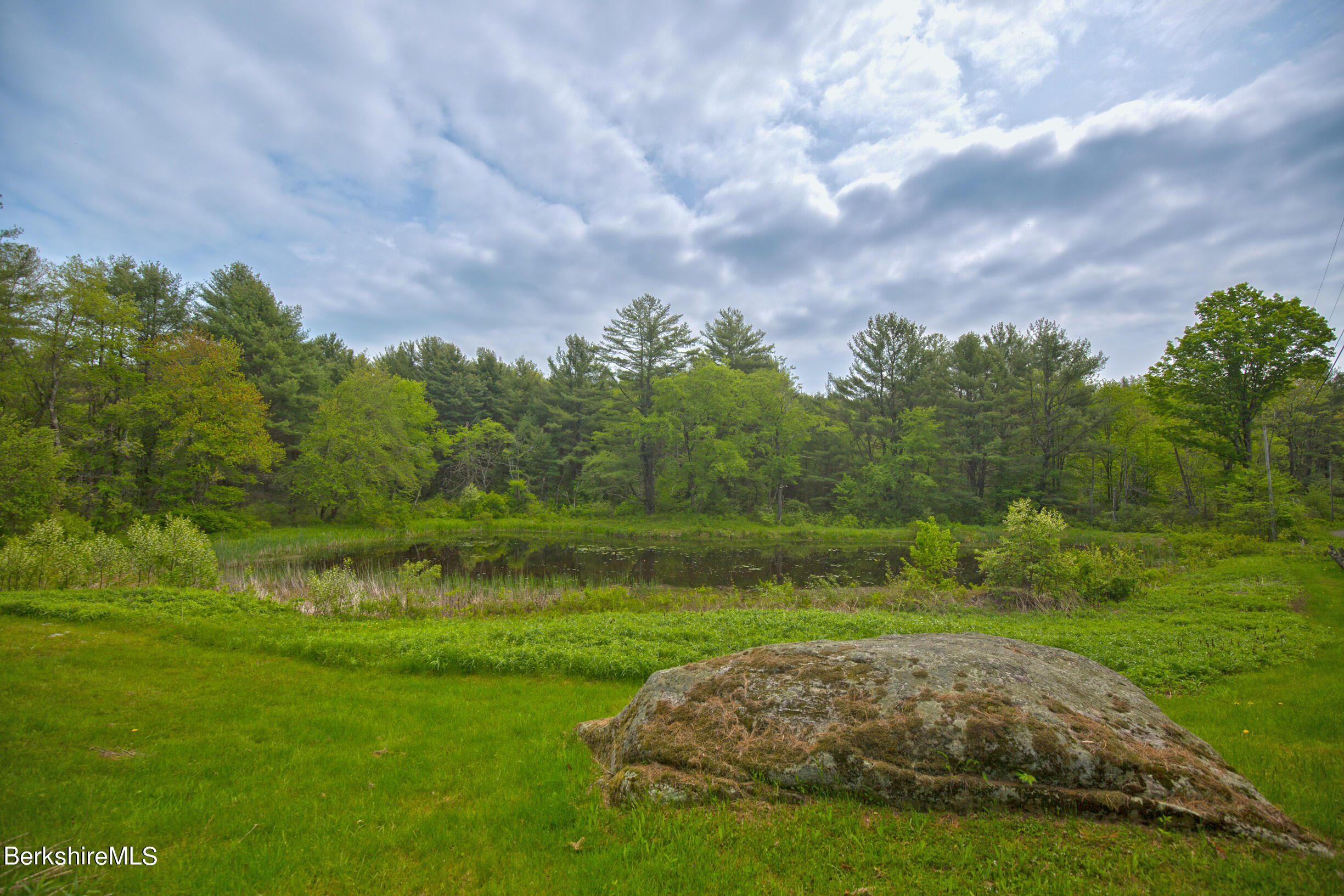 75 Old Quarry Road Otis, MA 01253 - Photo 34 of 39 a view of a golf course with a yard