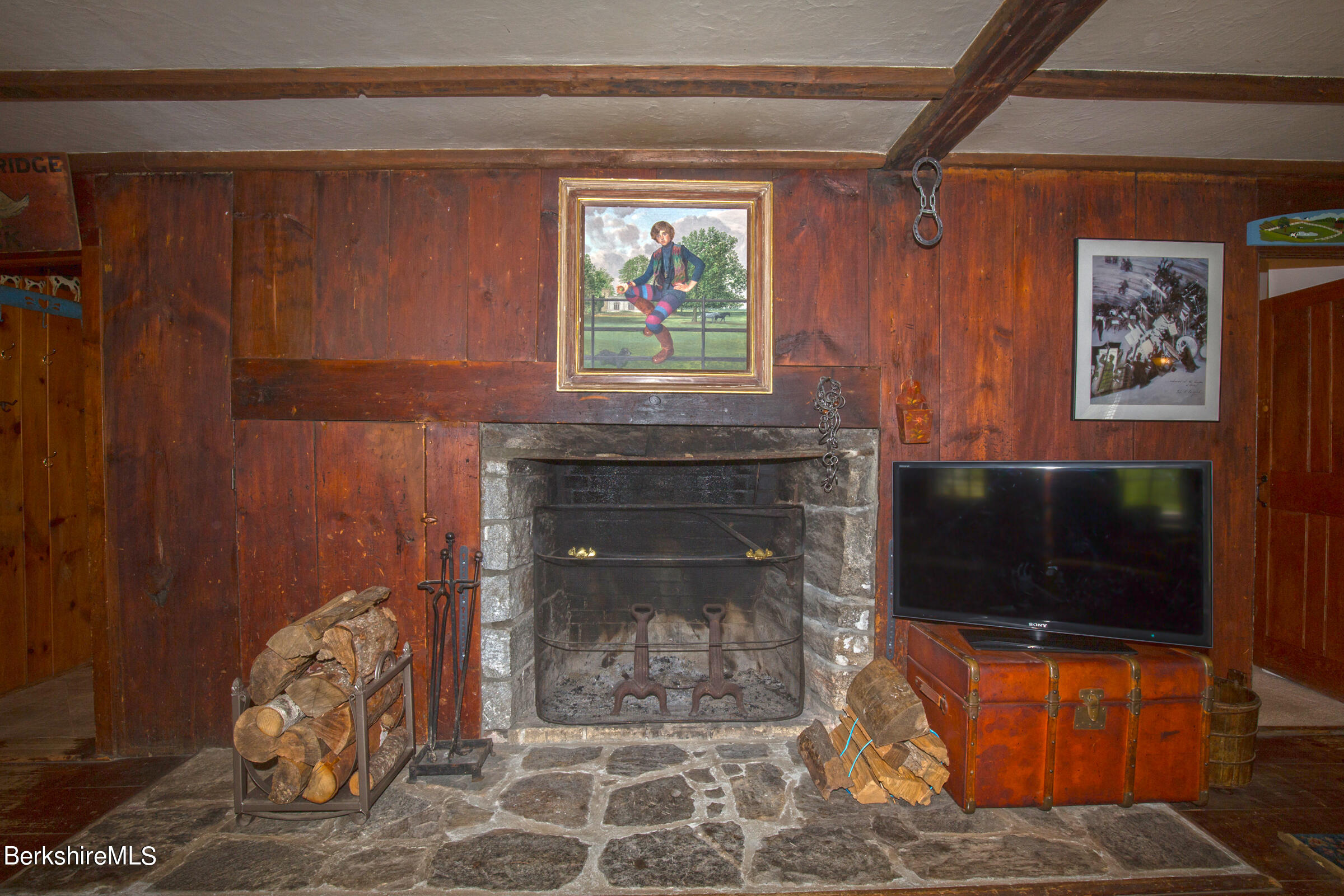 75 Old Quarry Road Otis, MA 01253 - Photo 9 of 39 a living room with furniture a fireplace and a flat screen tv
