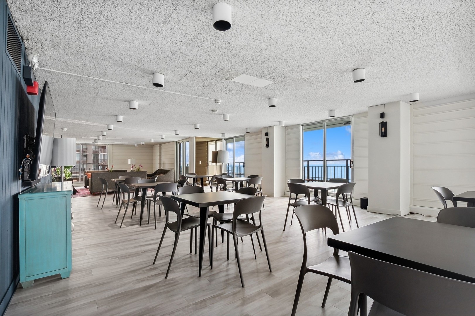 6033 North Sheridan Road, Unit 34M Chicago, IL 60660 - Photo 35 of 48 a view of a dining room with furniture and wooden floor
