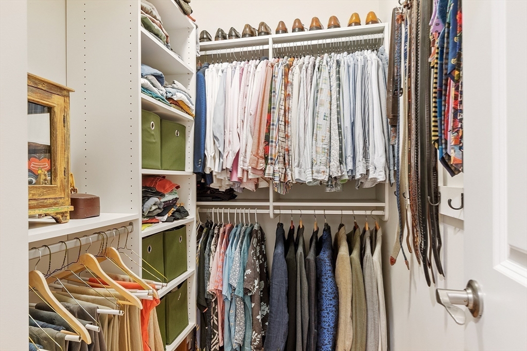 51 South Cottage Road, Unit 112 Belmont, MA 02478 - Photo 16 of 41 a view of walk in closet with clothes and shoes